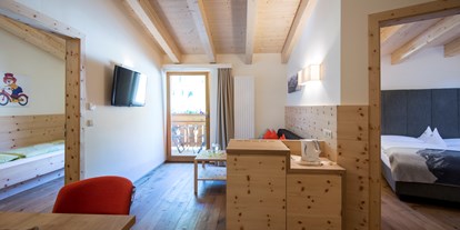 Hotels an der Piste - Verpflegung: Vollpension - Trentino-Südtirol - Familienzimmer Arnika - Familienhotel Huber