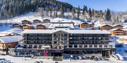 Hotels an der Piste - Parkplatz: kostenlos beim Hotel - Wagrain - Außenansicht- Winter - Hotel Adapura Wagrain