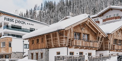 Hotels an der Piste - Kinder-/Übungshang - Skigebiet Zauchensee-Flachauwinkl - Außenansicht FIRSTpeak & Chalets - FIRSTpeak Zauchensee