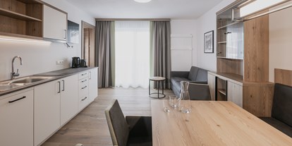 Hotels an der Piste - Rodeln - Skigebiet Zauchensee-Flachauwinkl - Wohn.- und Essbereich Appartement Suite - FIRSTpeak Zauchensee
