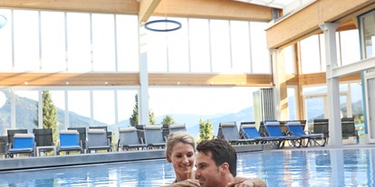 Hotels an der Piste - Kinderbetreuung - Dienten am Hochkönig - Nachdem Skifahren gönnen Sie sich die Auszeit in unserem Wellnessbereich mit tollem Schwimmbad - Schlosshotel Lacknerhof****S Flachau