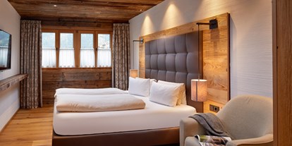 Hotels an der Piste - Wellnessbereich - Flachau - Schlafzimmer mit Doppelbett - Promi Alm Flachau