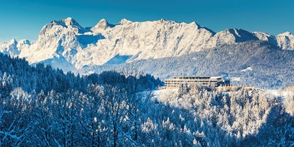 Hotels an der Piste - Suite mit offenem Kamin - Dienten am Hochkönig - Kempinski Hotel Berchtesgaden im Winter - Kempinski Hotel Berchtesgaden