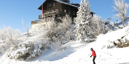 Hotels an der Piste - Trockenraum - Salzkammergut - Kranabethhütte mit Skifahrer Ski and Out - Kranabethhütte