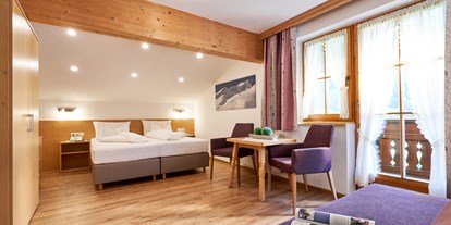 Hotels an der Piste - St. Anton am Arlberg - Dreibettzimmer - Hotel Garni Landhaus Strolz