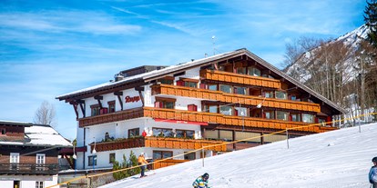 Hotels an der Piste - Pools: Innenpool - St. Anton am Arlberg - Ansicht Hotel Südseite zum Ideallift hin - Almhof Rupp - das Genießerhotel