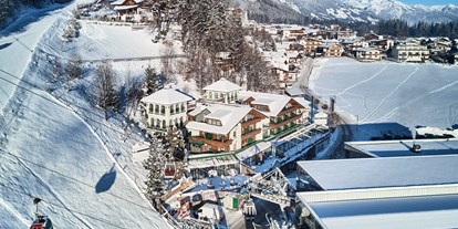 Hotels an der Piste - Skiservice: Wachsservice - Tiroler Unterland - Winteransicht - Wohlfühlhotel KERSCHDORFER - alpine hotel · garni superior · adults only