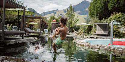 Hotels an der Piste - Hunde: hundefreundlich - St. Johann in Tirol - The Resi Apartments 
Pools und Schwimmteich im Garten - The RESI Apartments "mit Mehrwert"