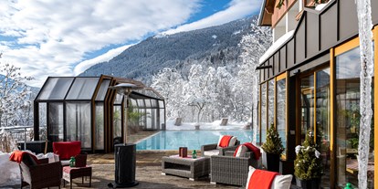 Hotels an der Piste - Ebene Reichenau - Beheizter & Überdachbarer Außenpool (Winter 31°C) und Blick auf unsere Sonnenterrasse  - Genusshotel Almrausch