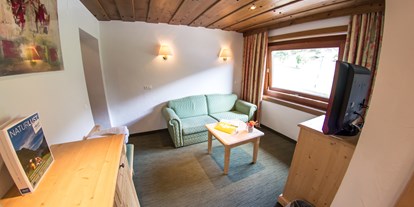 Hotels an der Piste - Hunde: auf Anfrage - Rennweg (Rennweg am Katschberg) - Wohnzimmer Junior Suite "Enzian Stube" - Hotel Berghof