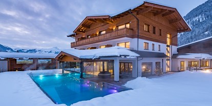 Hotels an der Piste - Klassifizierung: 4 Sterne - Kirchberg in Tirol - Aussenpool im Kitzspitz Wintergarten - Naturhotel Kitzspitz