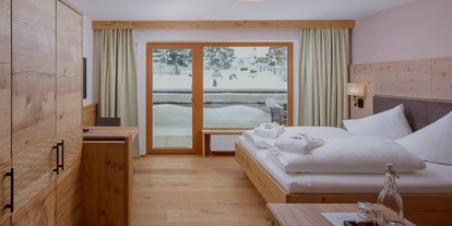 Hotels an der Piste - Klassifizierung: 4 Sterne - Skigebiet Buchensteinwand Pillersee - die Premium Zimmer Juniorsuite Melisse  - Naturhotel Kitzspitz