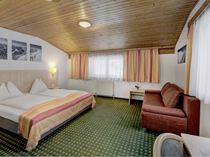 Hotels an der Piste - Verpflegung: Halbpension - Dienten am Hochkönig - Doppelzimmer Family - Hotel Bike & Snow Lederer