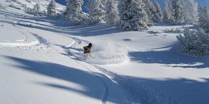 Hotels an der Piste - Skiservice: Skireparatur - Kleinarl - frisch verschneit - die Fageralm - Familienhotel Unterreith