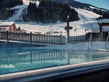 Hotels an der Piste - Trockenraum - Pinzgau - Rooftop-Relax-Area für Winterwellness - 4****S Hotel Hasenauer