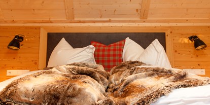 Hotels an der Piste - Hotel-Schwerpunkt: Skifahren & Familie - Nockberge - Schlafzimmer - Trattlers Hof-Chalets
