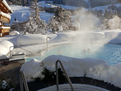 Hotels an der Piste - Hallenbad - Outdoor-Schwimmbad (31° C) & Whirlpool (38° C) - Erstklassig & down to Earth - das bio-zertifizierte Gartenhotel Theresia****S 