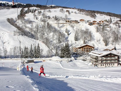 Hotels an der Piste - Pinzgau - Skischulübungsgelände vis à vis vom Hotel - Erstklassig & down to Earth - das bio-zertifizierte Gartenhotel Theresia****S 