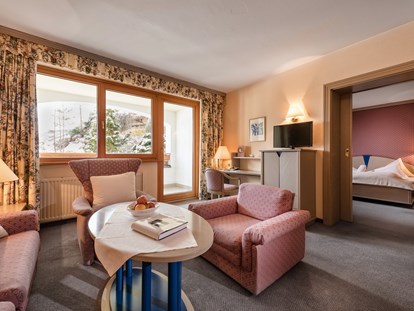 Hotels an der Piste - Hotel-Schwerpunkt: Skifahren & Familie - Nockberge - Wohnzimmer Grande Suite superieur Sterntaler - Hotel St. Oswald